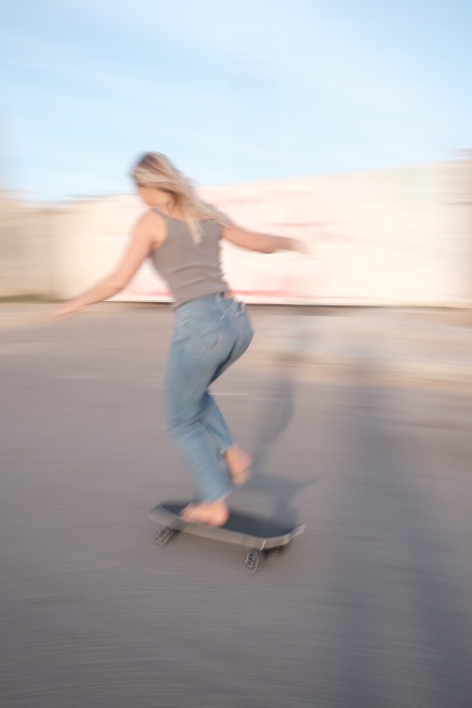 Girl surf-skating in imsouane. Blurry photo from longer exposure showing the movement