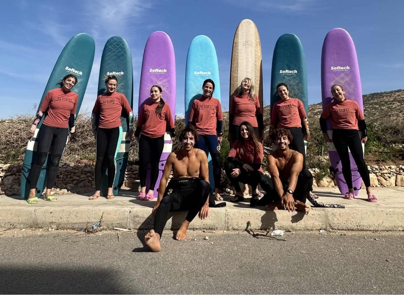 group of surfers ready for a lesson in sunny imsouane